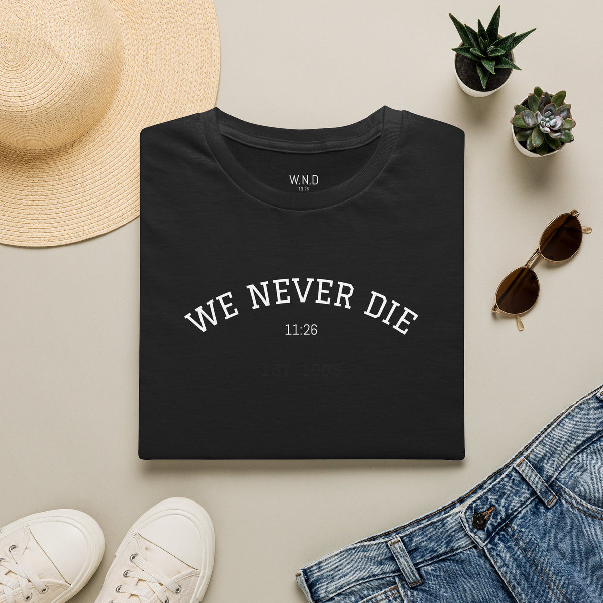 We Never Die T‑Shirt — Minimal Inspirational Graphic Tee