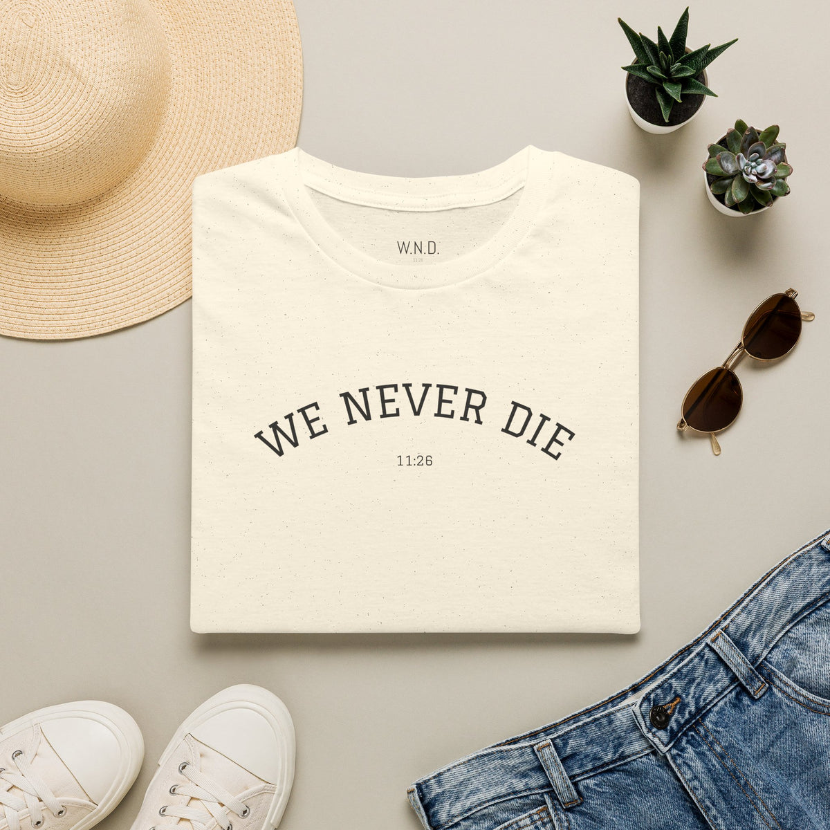 We Never Die T‑Shirt — Minimal Inspirational Graphic Tee