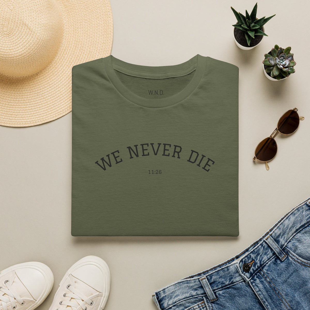 We Never Die T‑Shirt — Minimal Inspirational Graphic Tee