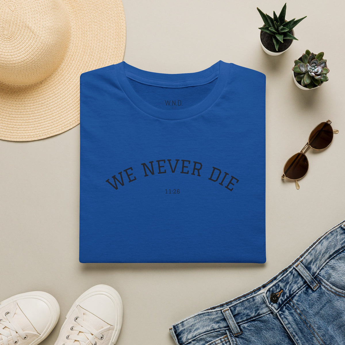 We Never Die T‑Shirt — Minimal Inspirational Graphic Tee