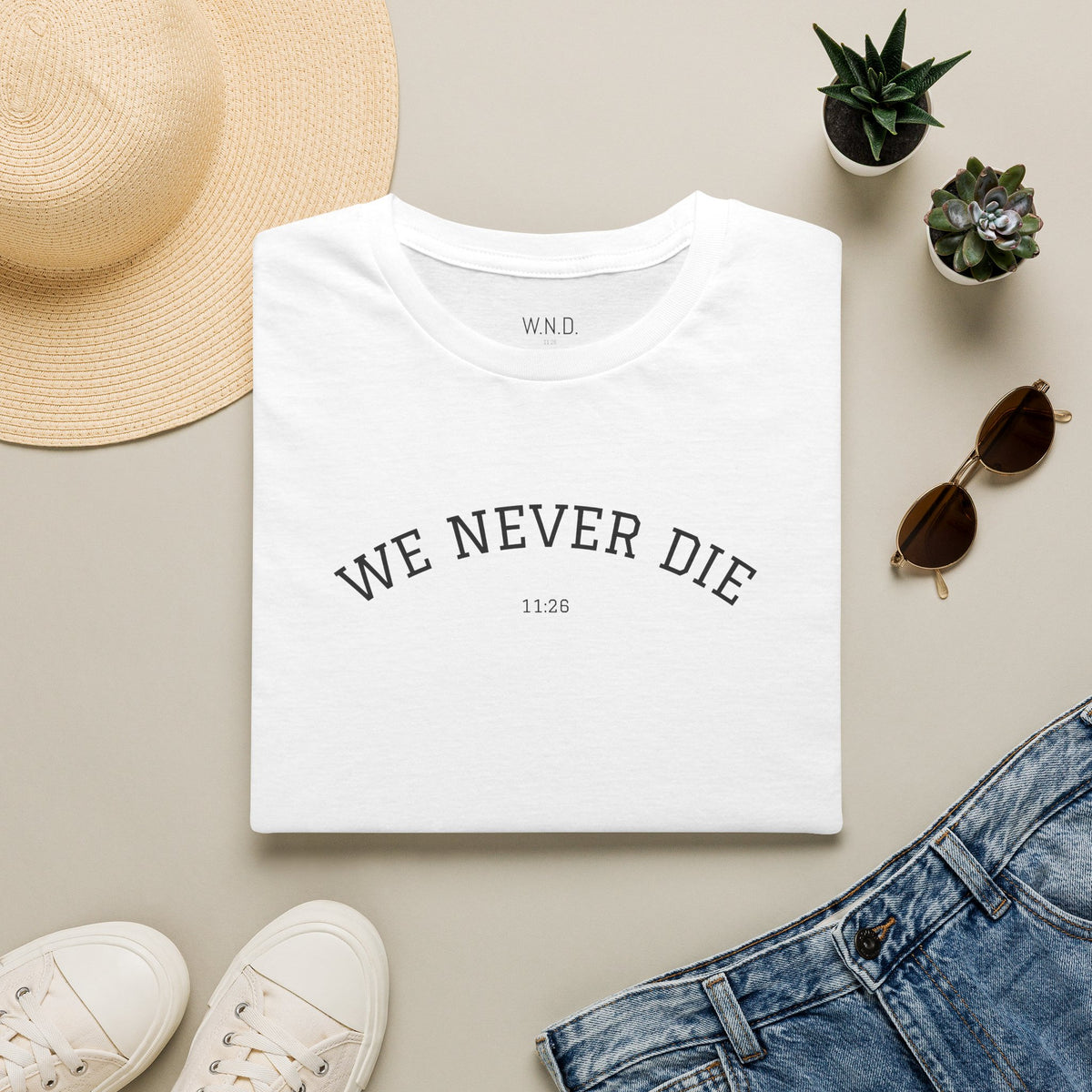We Never Die T‑Shirt — Minimal Inspirational Graphic Tee