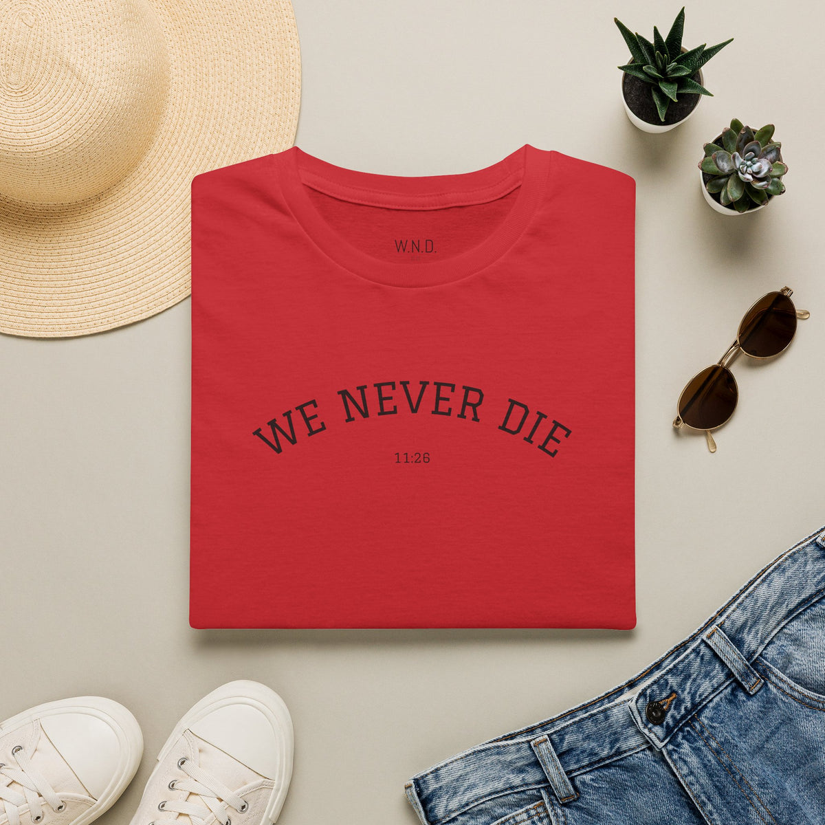 We Never Die T‑Shirt — Minimal Inspirational Graphic Tee