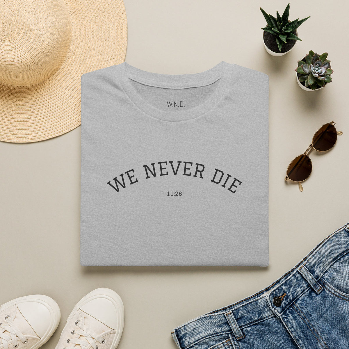 We Never Die T‑Shirt — Minimal Inspirational Graphic Tee